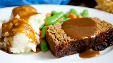 meatloaf with mashed potatoes and gravy and green beans